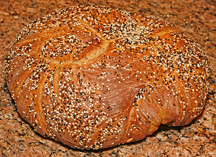 A finished loaf of multigrain bread.