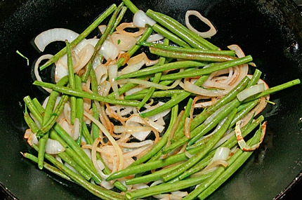 Maximum amount of ingredients in a home wok is about 3 cups of stuff.