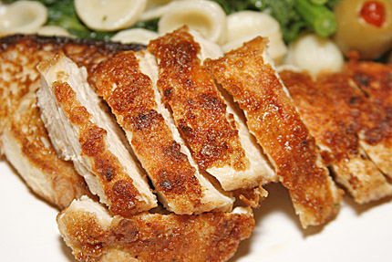 Close-up photo of chicken with brocolli rabe and orechetti.