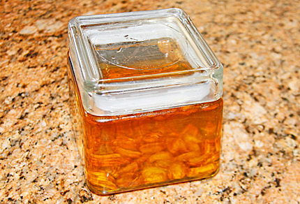Jar of finished roasted garlic oil.