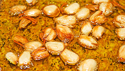 Finished roasted garlic cloves in olive oil.