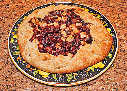 Photo of a cherry-apple galette, a French rustic tart.