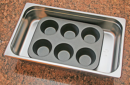 Photo of steam tray pan with an over-sized muffin pan inside.