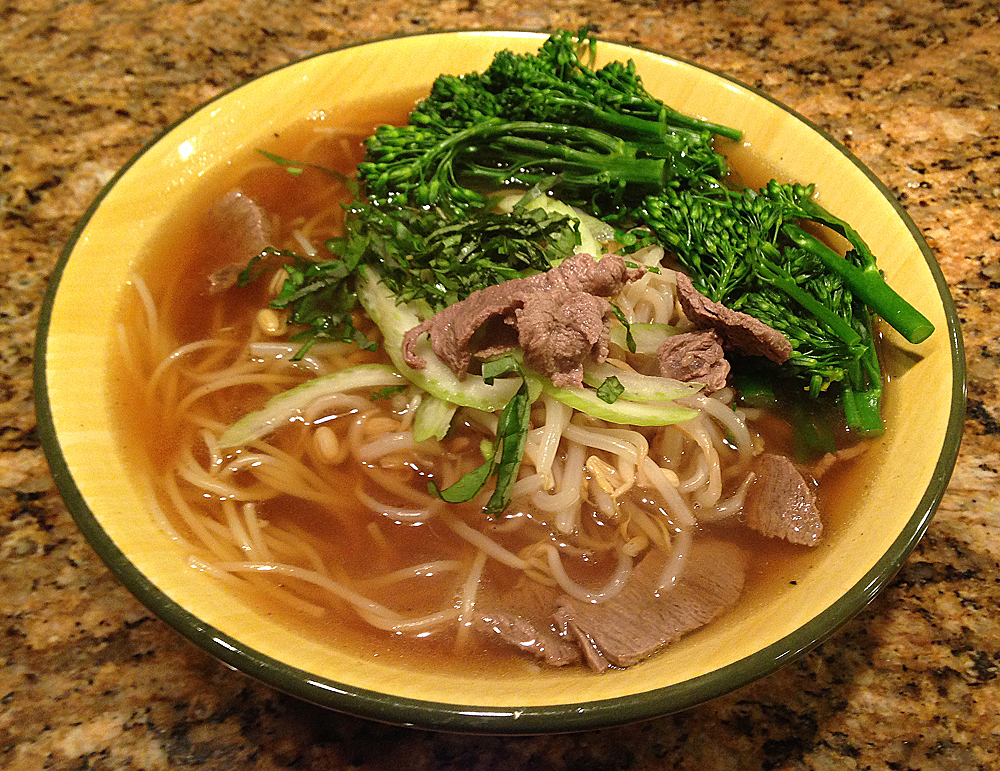 Bowl of pho bo Vietnamese beef noodle soup.